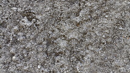 Vintage background of weathered stone wall with rough concrete texture and grunge surface pattern,...