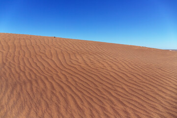 Beautiful sand dune with blue sky.