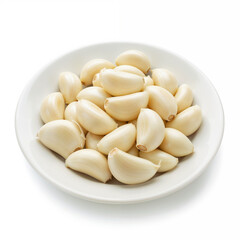 Fresh garlic cloves sit peeled on a white plate ready for cooking use