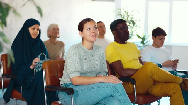 Portrait of students of different years and of different nationalities on training session in lecture hall - Powered by Adobe