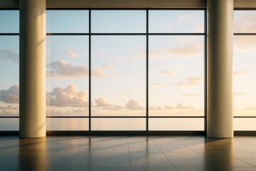 Naklejka premium Modern empty interior room with large windows overlooking ocean horizon at sunset, warm light, minimal design, contemporary architecture style.
