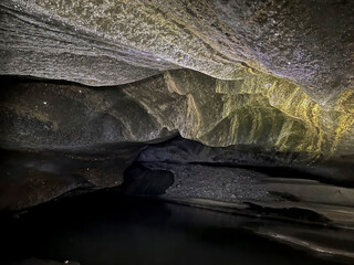 Frozen river in ice cave in Alaska