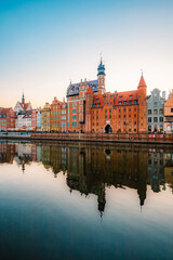 Fototapeta premium Gdansk with Motlawa river in Poland. Old town colourful house with Holy Spirit Gate