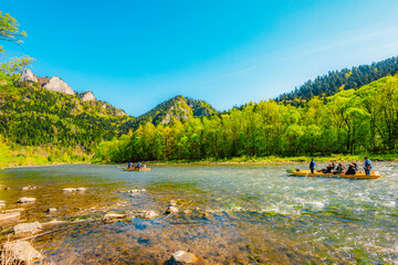 Peak Tri Koruny or Trzy Korony during day with green meadow and trees in spring. Pieniny National park in Slovakia and Poland © Zedspider