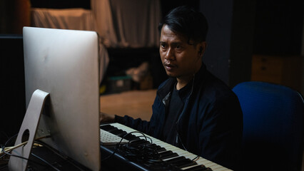 Audio Engineer Working in Music Studio with Headphones