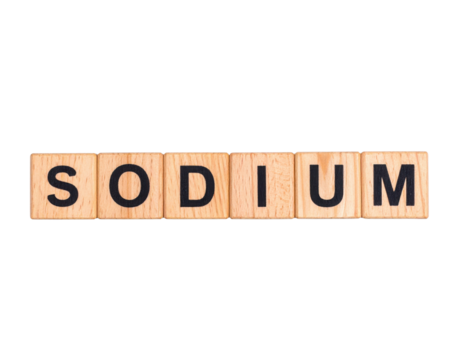 Wooden letter tiles spell out the word "SODIUM" in uppercase black font, arranged in a single line.