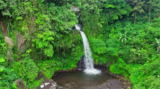 Drone view of jedor waterfall. aerial view of indonesia tropical waterfall in central java 