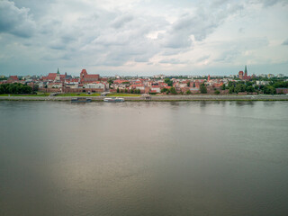 Fototapeta premium Castle Ruins in Toruń with a View of the Old Town on the Vistula River, Poland.