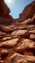 Fototapeta premium Low angle shot of rocky canyon path with smooth stones and warm colors, evoking sense of adventure and exploration