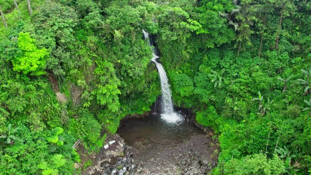 Drone view of jedor waterfall. aerial view of indonesia tropical waterfall in central java 