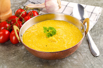 Vegetarian corn cream soup served parsley