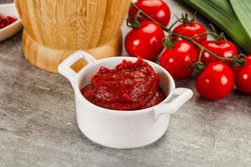 Red tomato paste in the bowl