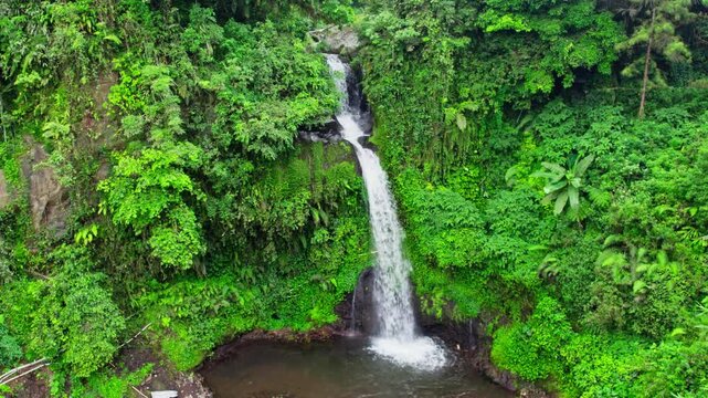 Drone view of jedor waterfall. aerial view of indonesia tropical waterfall in central java 