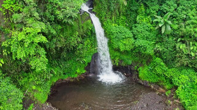 Drone view of jedor waterfall. aerial view of indonesia tropical waterfall in central java 