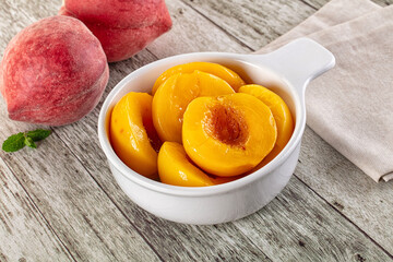 Sweet ripe yellow canned peaches