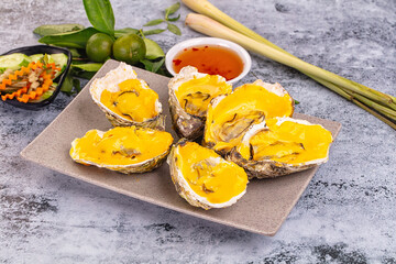 Baked oyster with cheddar cheese