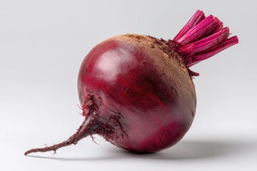 Isolated red beet root placed diagonally
