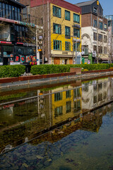 Street with shallow pond and colourful houses in South Korea