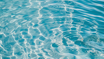 Obraz na płótnie Canvas Top-down view of vibrant blue water with natural ripples and soft reflections. Realistic texture ideal for summer backgrounds or design elements.
