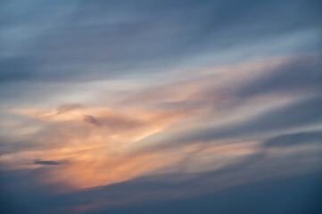 Sunset sky with soft clouds as background.