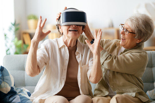 women playing console games wearing vr goggles