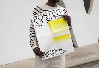 Mockup Of Man Holding Customizable A2 Poster