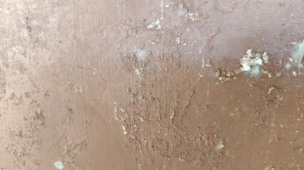 Old vintage wall surface with aged and rustic textures, featuring worn and cracked details, perfect...