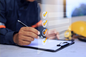 Engineering check list concept with technician working in office desktop to review item and checking machine daily checklist before start working operation
