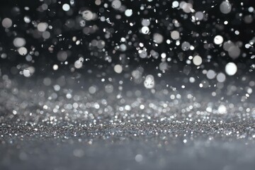 Scattered silver glitter floating mid-air