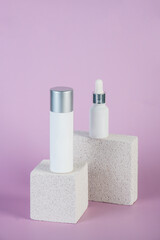 Plastic white tube for cream or lotion. Skin care or sunscreen cosmetic with stylish props on purple background.