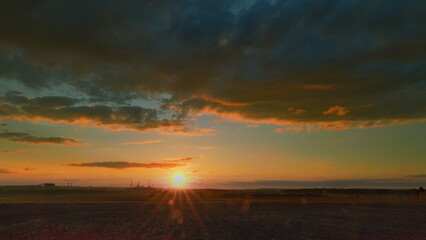 Experience a stunning sunset with dramatic clouds that evokes tranquility and calmness