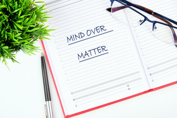 The conceptual phrase MIND OVER MATTER. The concept of beauty and health. Business and Keep an open...