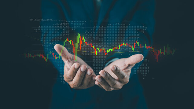 Hands holding a digital stock market graph with a world map background, symbolizing global finance and data analysis.