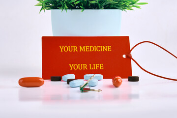 The conceptual phrase is YOUR MEDICINE YOUR LIFE. Invest in your health Concept.