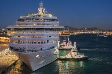 Mega family cruiseship cruise ship liner Fortuna docked at terminal in Marseille Provence, France during breathtaking sunset sunrise twilight blue hour dusk dawn silhouette scenic panorama