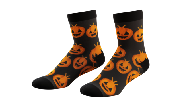 A pair of black socks with orange jack o'lanterns on them against a plain black background isolated on transparent background