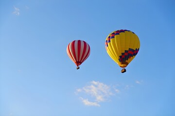 Colorful Hot Air Balloons Floating in Clear Blue Sky