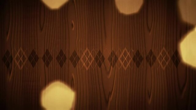 Warm light bokeh effects softly move across a brown wooden background with argyle patterns, creating a cozy abstract video