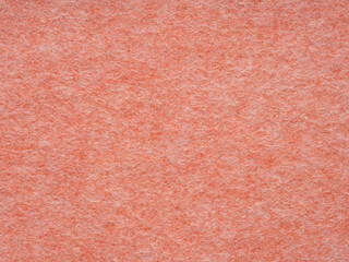 Warm coral hues blend in a soft, textured embrace, evoking comfort and simplicity in visual harmony