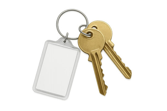 Golden keys linked on metal ring with blank white tag, suspended against transparent backdrop, waiting for personalized messaging