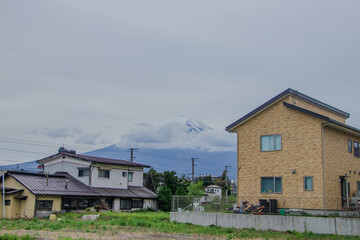 Many people visiting Japan are sitting together in a creative meeting to discuss big projects.