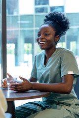 African american doctor talking to a female patient and looking positive
