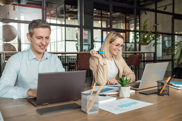 Layers working in the office and looking busy and contented