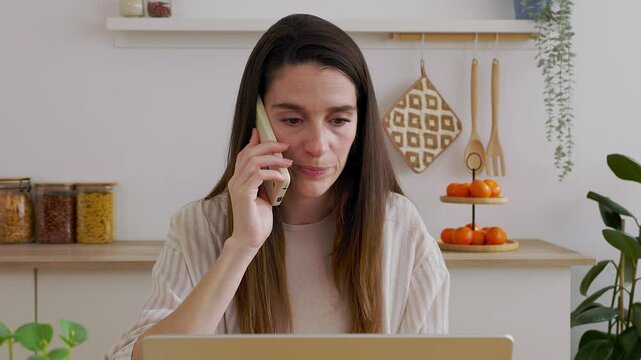 Young angry woman talking on phone disputing over laptop problem, stressed unsatisfied impatient customer arguing by mobile solving online difficulty with technical support complain on bad service 