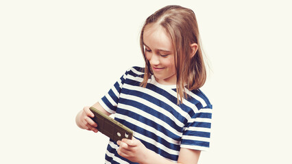 Fototapeta premium Student with mobile phone. Happy kid with gadget. Excited boy playing games on mobile phone