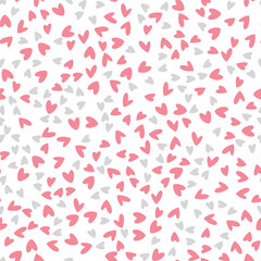 Seamless vector pattern in a simple childish style. Cute pink and gray hearts on white background. Valentine's Day pattern. Vector illustration