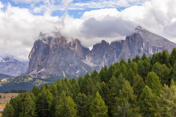 Dolomites Alpe di Siusi, Italy beautiful scenery, natural autumn landscape with Sassolungo mountain and meadows