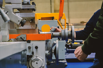 Operating a Lathe Machine in a Manufacturing Facility with Precision Tooling for Production...