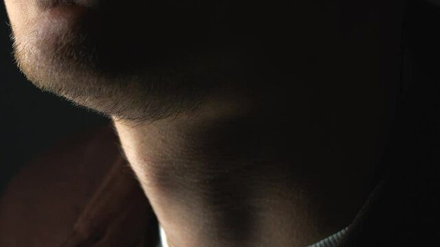 a person moves his Adam's apple while swallowing.
Swallowing process.
Male Adam's apple and body anatomy