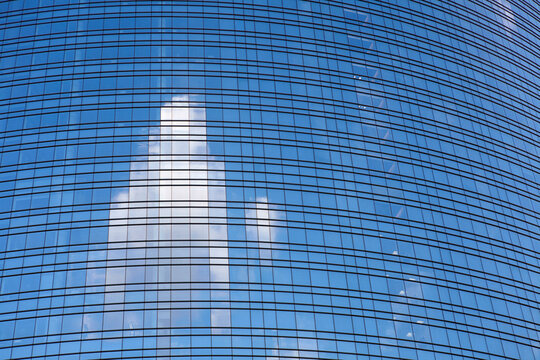 Close up of a glass palace at the modern district of Porta Nuova, Milan, Italy